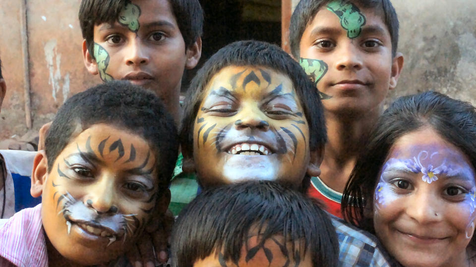 A selection of children with their faces painted